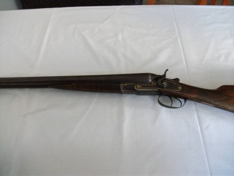 Hola, quisiera saber si alguien me puede informar sobre la marca de una escopeta y su antigüedad. El antiguo 02