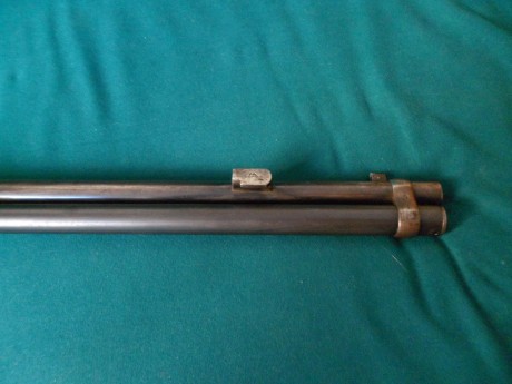 Poseo un Winchester 1892 original, en el lado derecho del cañon tiene un enganche para bayoneta, buscando 31