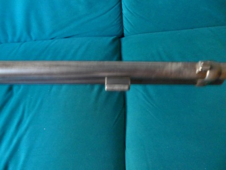 Poseo un Winchester 1892 original, en el lado derecho del cañon tiene un enganche para bayoneta, buscando 30