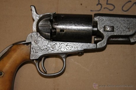Hola este revolver fue comprado  por un amigo,  es un  COLT NAVY FABRICADO EN BELGICA ( Lieja) en la segunda 31