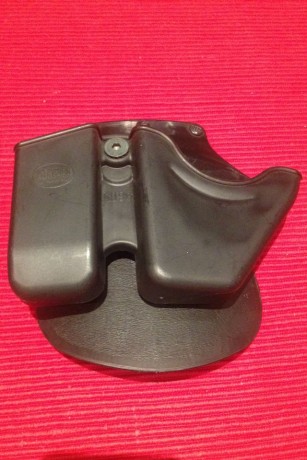 Se VENDE magnifica funda FOBUS, a estrenar, para el porte de cargador y grilletes.
La funda está fabricada 00