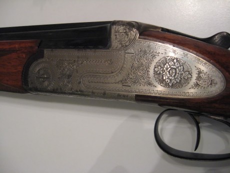 Hola  alguien conoce esta escopeta del calibre 20,no conozco al fabricante.
un saludo. 10