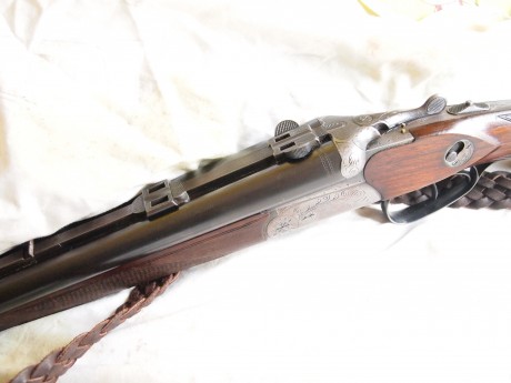 drilling Merkel , con cañones de escopeta calibre  12/70 12/70 y cañon de rifle  7x57r , lleva un visor 02