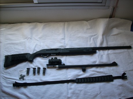 Hola vendo mis escopeta marca HTSAN, modelo escort slug combo, calibre 12,con  DOS cañones, el cañón de 02