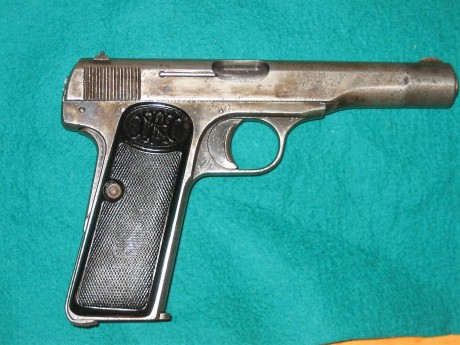 Hola. Vendo FN 1922, calibre 7.65 (32 Acp) en libro de coleccionista. Con marcajes alemanes en armazón 00