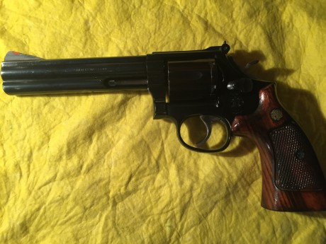Vendo revolver s & w , cal 357 , color negro , seis pulgadas , seminuevo, se ha disparado muy poco 01