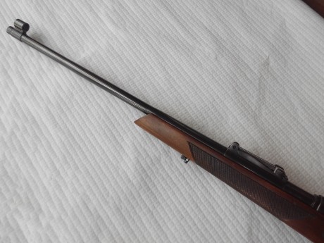 Buenas tardes.

Un fusil español transformado para caza,sus características son:
-Cañón torneado quitando 00