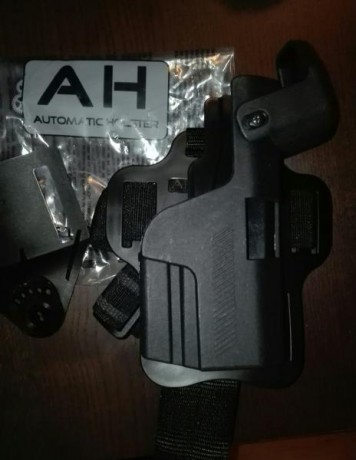 VENDO FUNDA Y PERNERA PARA HK USP COMPACT MARCA AUTOMATIC HOLSTER (NUEVOS).  LA FUNDA TIENE SU PIEZA DE 00