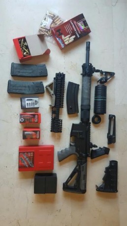 ...Como quiera que no le doy uso pues cuenta sólo con unos 80 disparos, se vende conjunto formado por:

-DPMS 00