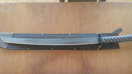 Cambio movil iphone 5 C color rosa es libre 16 gb y una katana de cold steel acero carbono 1055 muy afilada 11