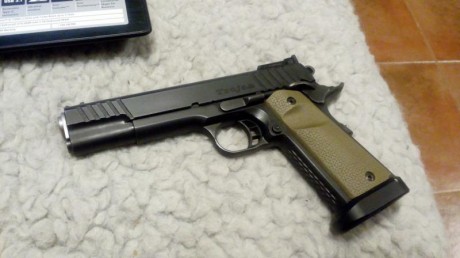 Se vende STI Trojan 9mm. 
Unico dueño comprada hace 1 año.
Cañon de 5"
Cachas Magpul  color desert.
 20