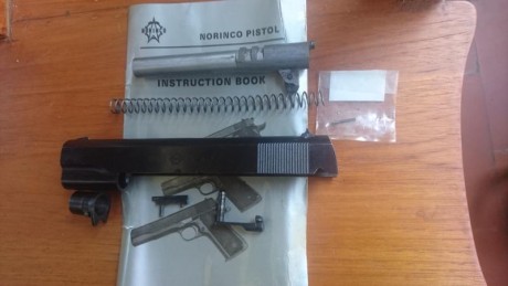 Vendo pistola modelo 1911 de Norinco con dos cañones: 45 ACP y 9 mm, cachas de madera, alza para el cañon 11