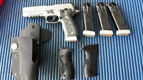 Por cambio de marca pongo a la venta esta máquina...la entregó con 5 cargadores y funda de extracción 02