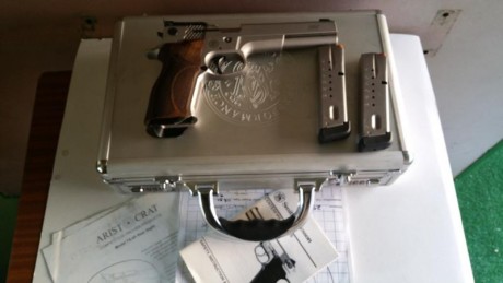    Se vende Pistola S&W Performance center Model 5906 PPC-9 6"   

   Con 3 cargadores.
3 Cachas.
Una 20