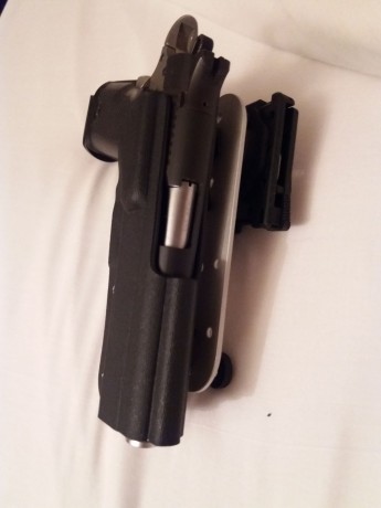 Vendo pistola BUL M5 5" .45 ACP con dos cargadores de 14 y uno de 12.

Para quien no la conozca es 02