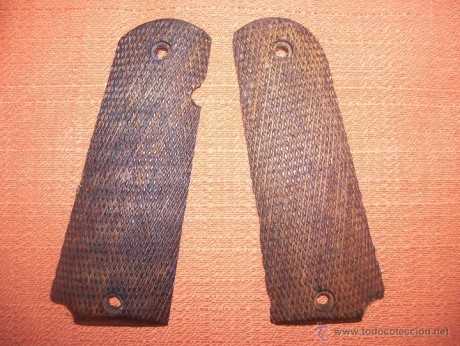 Busco pareja de cachas de pistola llama extra 9mm  nuevas o en buen estado 00