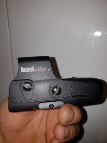 Vendo bushnell holosight 3 gen. Con muchas pilas de repuesto y una base weaver de quita y pon a carril 00