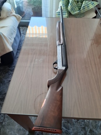 Buenas, estoy buscando una escopeta benelli sl 123, que esté en perfecto estado y en el lateral, en los 10