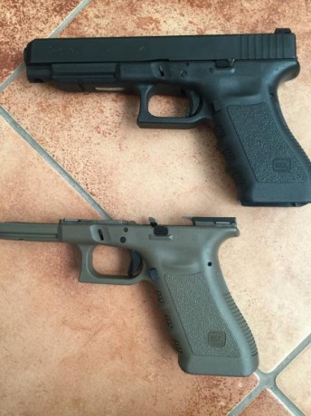 Vendo pistola glock 35, calibre .40 con 4 cargadores, maletín original, funda blackhawk, portacargador 02