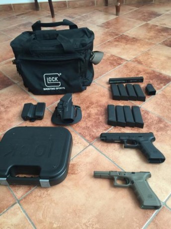 Vendo pistola glock 35, calibre .40 con 4 cargadores, maletín original, funda blackhawk, portacargador 00