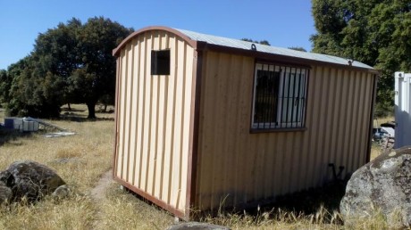cambio caseta de obra en buenas condiciones de 4.50 de largo x 2.35 de ancho x 2.4 alto, esta segun se 00