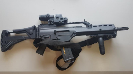 Hola, por dejar de usar el G36 vendo:

 Un Rail superior picatiny original de HK, con miras abatibles, 00