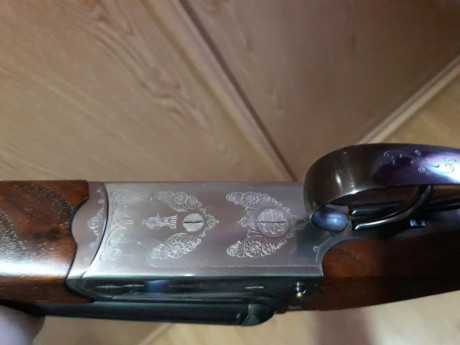 un amigo vende un rifle express Merkel 140 calibre 9,3x74r expulsor lleva un aimpoint  micro h2 balea 00