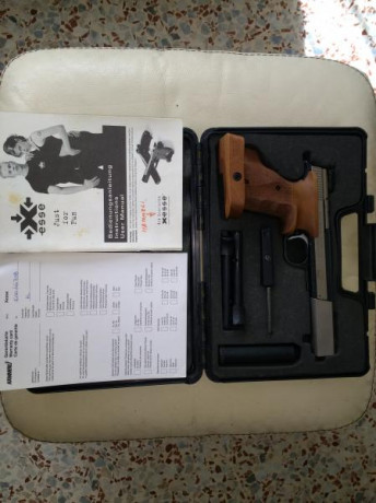 La pistola es la Suiza, está mejorada con contrapeso de 160 gramos, cacha anatómica Nill, talla M (nueva). 00