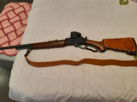 Hola cambiaria un marlin 444 muy bien de maderas y pavon con seguro lateral y visor punto rojo Vector 00