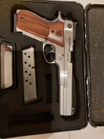 Pongo a la venta esta pistola impecable de 9 mm SW952 de 6" es de un compañero ruego se pongan en 01