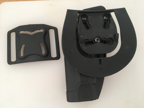 Funda fabricada en polímero de alta resistencia. Para tipos de pistolas beretta 92  totalmente Nueva. 01