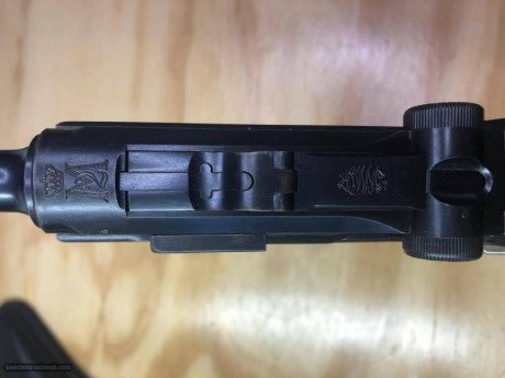 Por favor, busco Luger DWM 1906 Portuguesa, 7,65 mm, cañón militar de 4/34 ", empuñadura de seguridad, 01