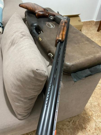 Buenas,un amigo me pide que ponga a la venta esta Perazzi sco corona de oro del tiro al plato que esta 02