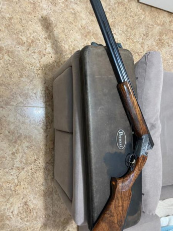 Buenas,un amigo me pide que ponga a la venta esta Perazzi sco corona de oro del tiro al plato que esta 01