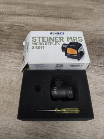 Punto rojo steiner MRS como nuevo. Enlace con características. 
https://www.steiner.de/de-de/es_ES/cat/productos-10986/shooting-10951/Sights-10917/Micro-Reflex-Sight-10927/
250€ 02