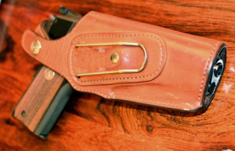 hola pongo a la venta mi COLT 1911 Gold Cup National Match MID RANGE del calibre 38 WC, que es la pistola 12