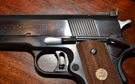 hola pongo a la venta mi COLT 1911 Gold Cup National Match MID RANGE del calibre 38 WC, que es la pistola 42