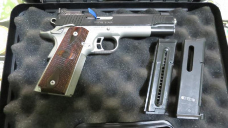 Para comprar un modelo superior, vendo esta Kimber bitono 1911 cal 22 LR, en perfecto estado, con su estuche, 02