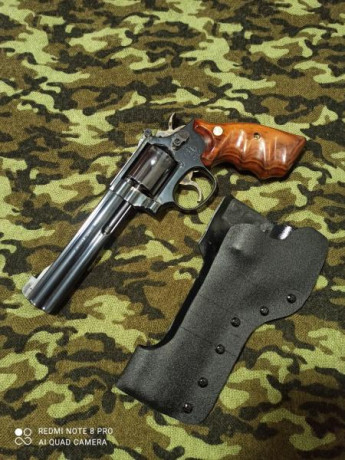 Revolver smit wesson modelo 14-5 6" y calibre 38 spl con 11 cargadores de pla y 9 fundas , funda 00