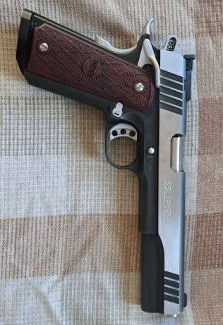 Un saludo 
Vendo mi pistola SPS FALCON MASTER duotone del 
9mm y cañón de 6 pulgadas. El arma está completamente 02