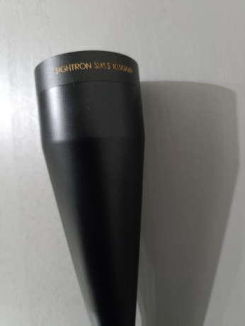 Vendo visor de tiro o rececho, en muy buen estado, pequeña marca en tapón derecho, del armario (armero), 02