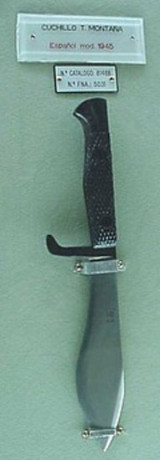 Hole, necesito vuestra ayda para identificar este machette. :oops:  Se parece muchisimon al que se le 30