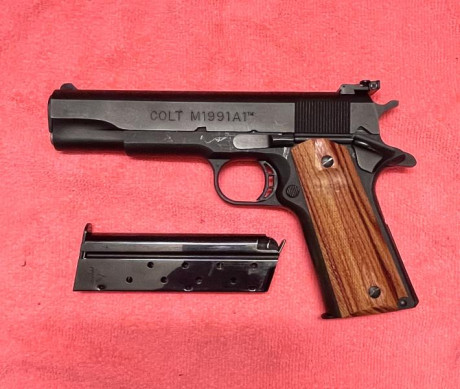 Vendo Colt 1991 A1 serie 80 En perfecto estado, pocos tiros. Cachas originales de goma mas otras de madera. 10