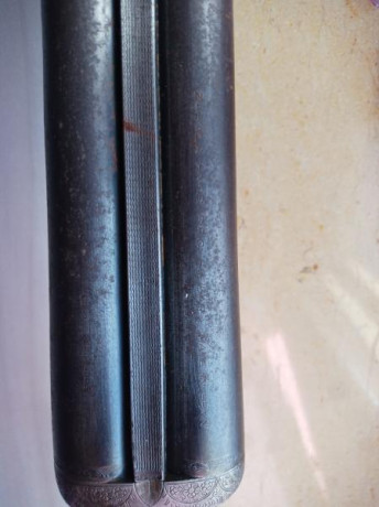 En estado de restauración, cal 12,  *** y * , con expulsores automáticos. Tiene dos pequeños golpes por 21