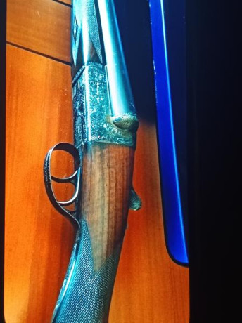 Paralela de caza Aya modelo XXV BL . ( media pletina), 
dos gatillos,  cañón de 63,5 centímetros con solista 10