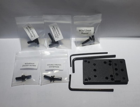 hola 
hace unos meses compra una placa de montaje para punto rojo 
se monta en el cañon de la Ruger PC 12