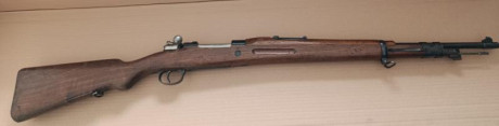 MAUSER modelo Coruña, calibre 8x57, año 1950, misma numeración en armazón, cierre y cargador, incluye 02